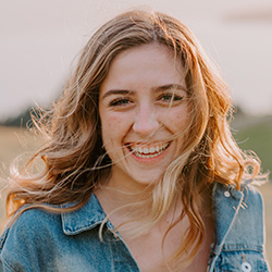 Girl laughing with sunlight behind her