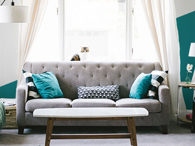 Living room with walls painted with both gray and teal