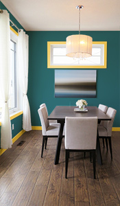 Dinning room with teal walls and yellow gold trim