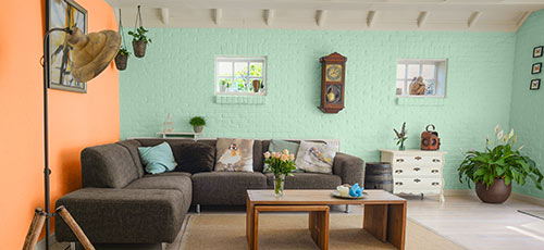 Room with bright orange and sea green walls