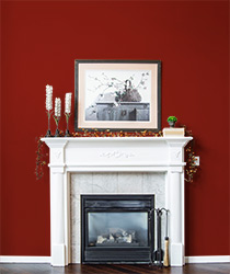 Fireplace with a dark, deep red behind it