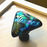 Picture of Black Teal Pull on black base on drawer front.