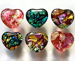 Picture of six rose, red, and blue glass hearts.