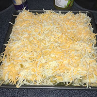 enchiladas prepared befor cooking with cheese on top