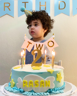 A picture of Rasah's two-year-old birthday party while he was just waking up