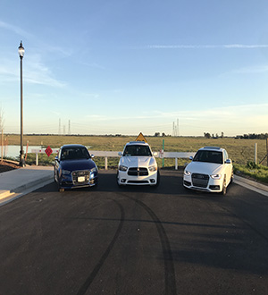 Audi S3 Dodge Charger and Audi S4 facing the cali sunset