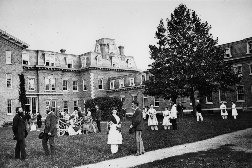 old timey oneida people in courtyard