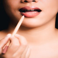 woman with lipbrush