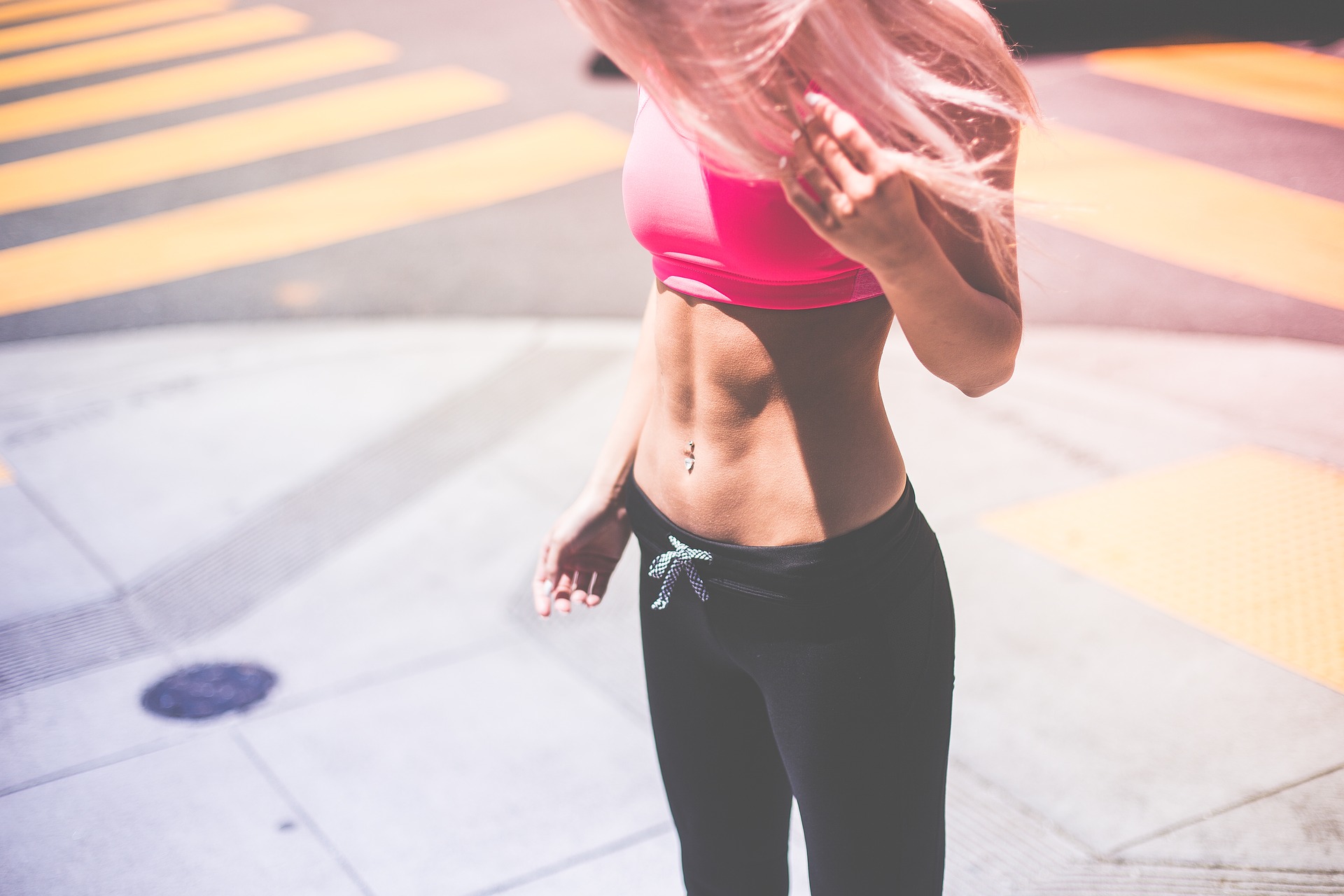 athletic woman's torso in workout clothes