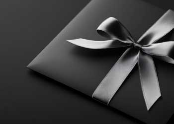 image of black gift card with a bow