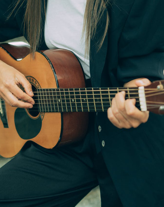 person holding a guitar