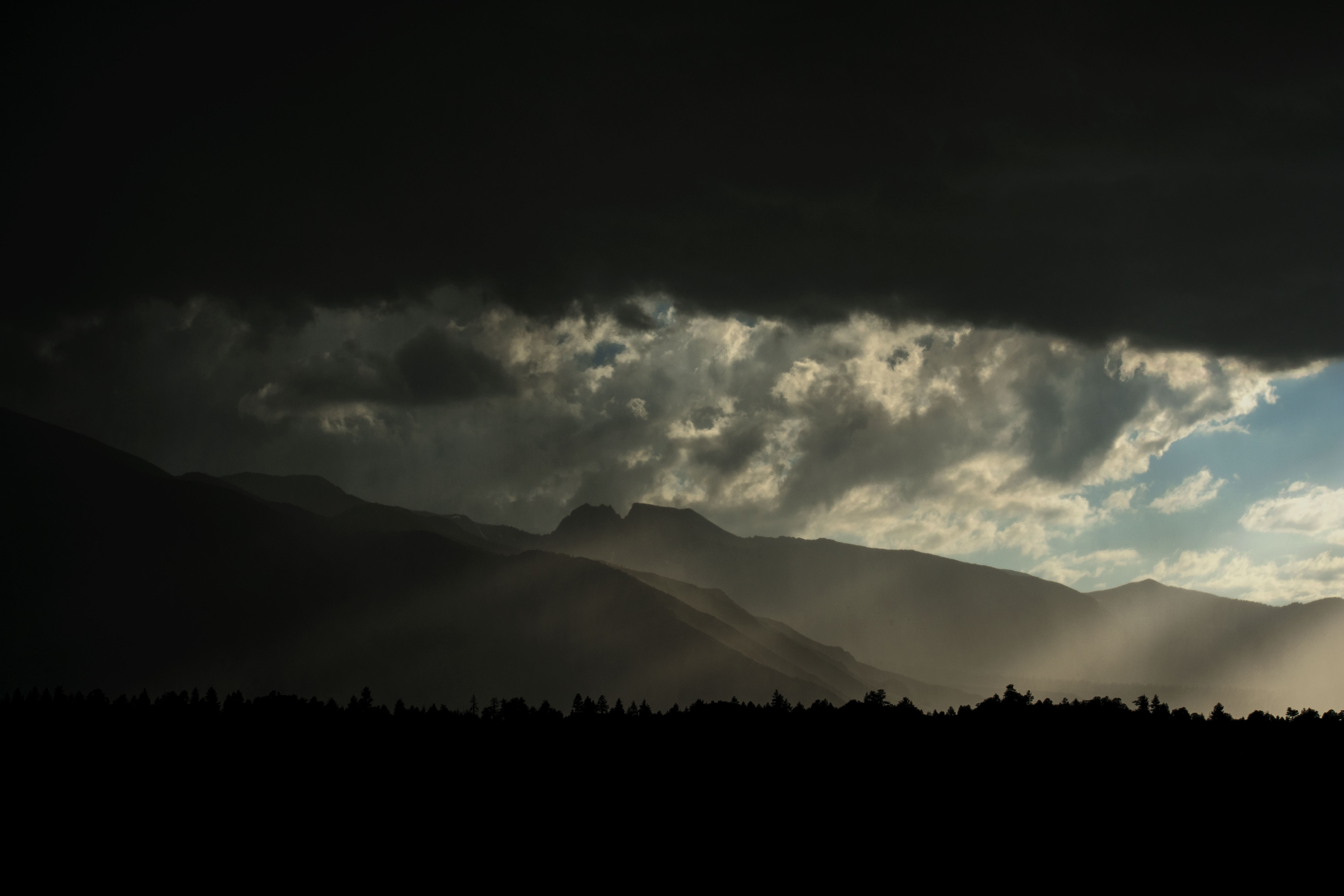 storm with rays of light poking through